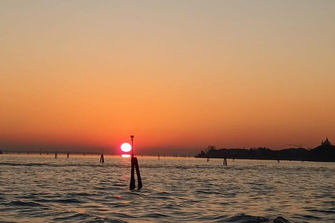 Aperitif at sunset in the Venice lagoon on a private boat. - Private pacing, small-boat comfort, and what the host really adds