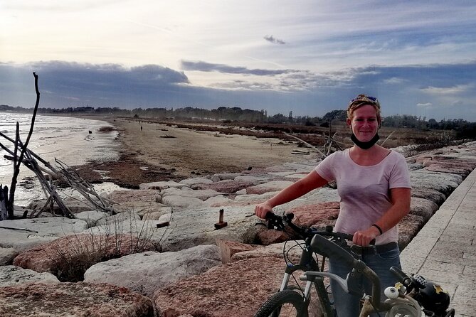 Lido Bike Tour: With a Local on the Island of Cinema - Faro di San Nicolò: The Lighthouse View That Reframes Lido