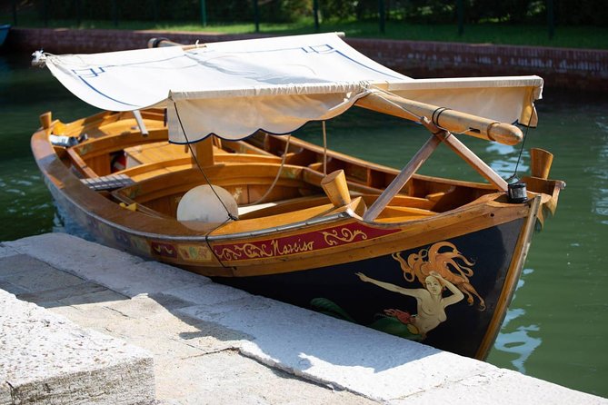Sunset Traditional Boat Tour with Prosecco - A traditional wooden boat, powered (so hearing can be tricky)