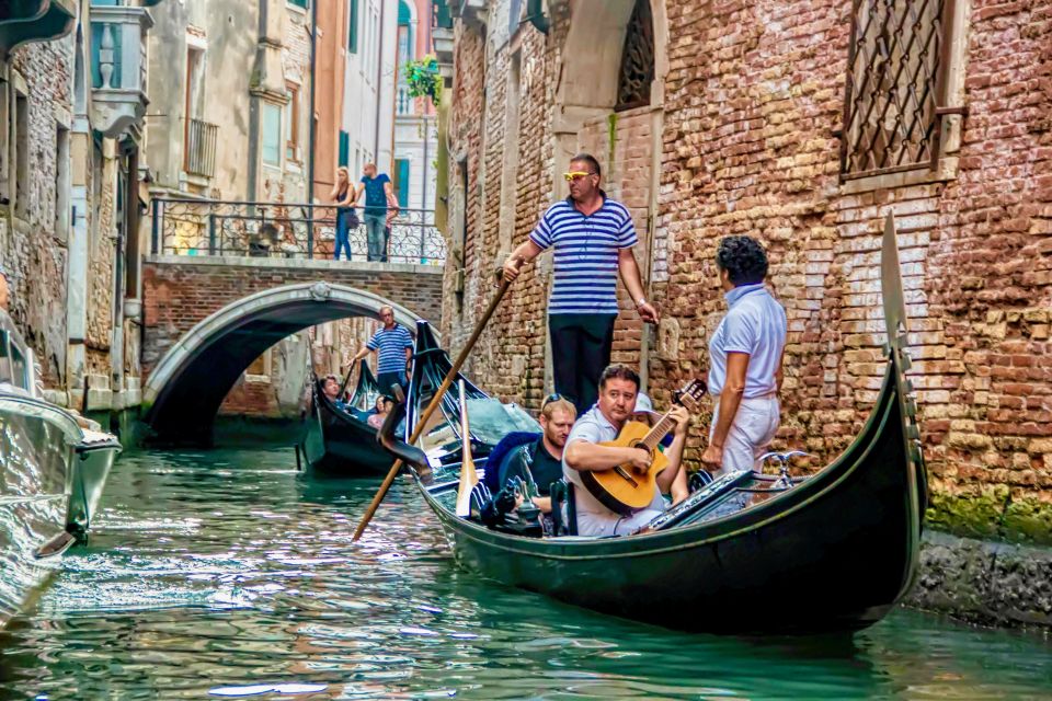 Venice: 30-Minute Gondola Ride on Grand Canal with Serenade - Santa Maria della Salute Stop: The Route Turns Toward Iconic Venice